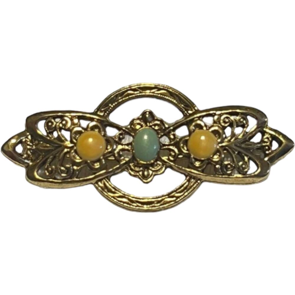 Vintage Gold-Tone Oval Lapel Pin with Trim Elegant 1980s Brooch